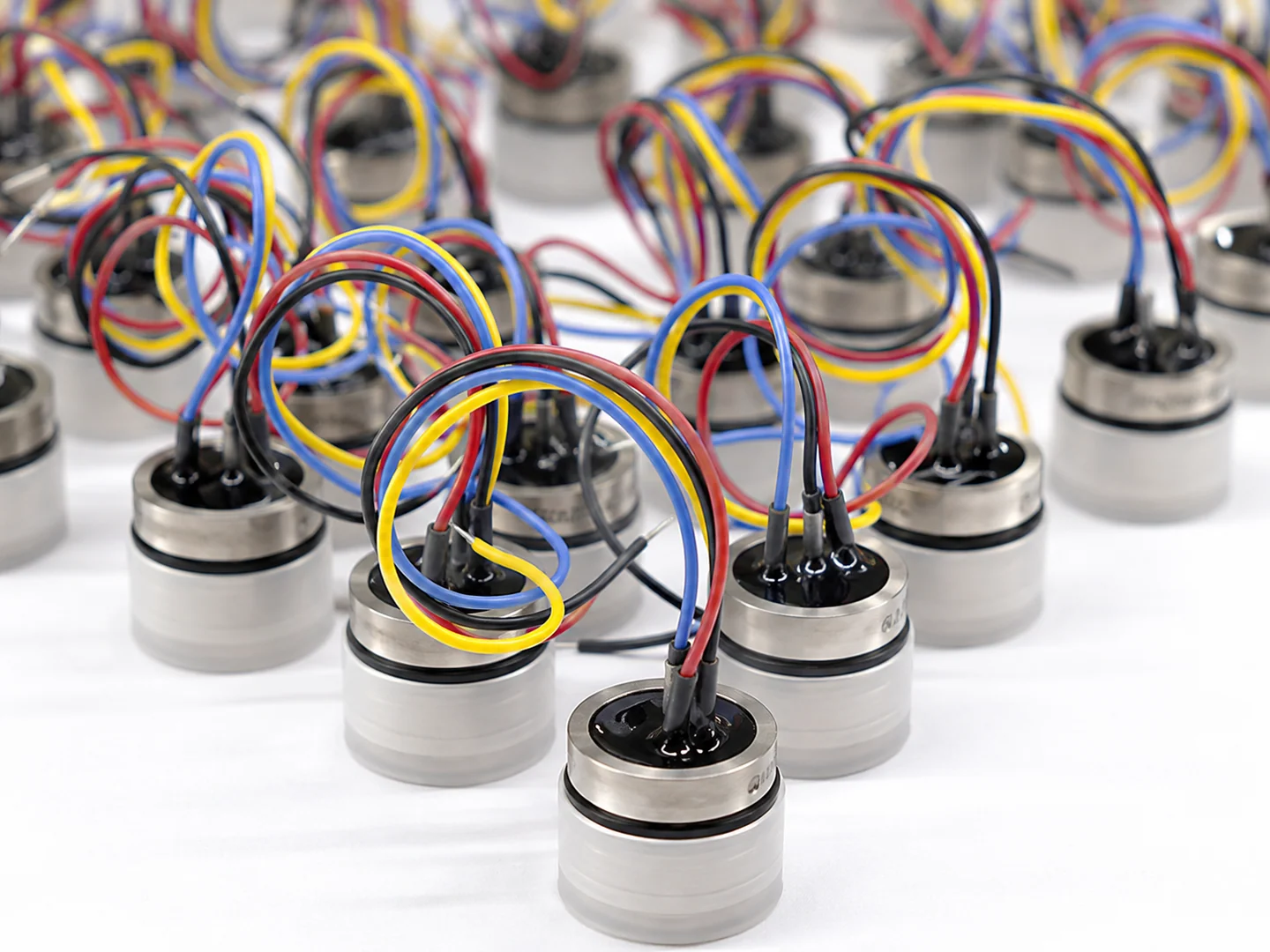 Silver sensing elements with coloured wiring on a work surface