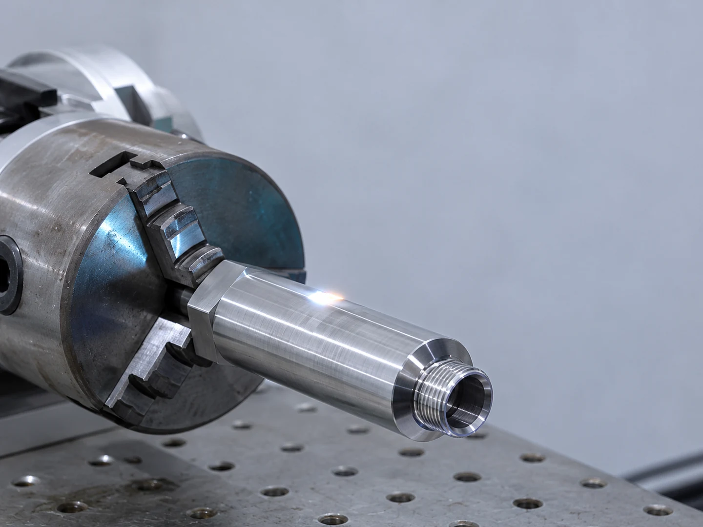 Metal instrument body held in a rotary fixture in an instrument workshop