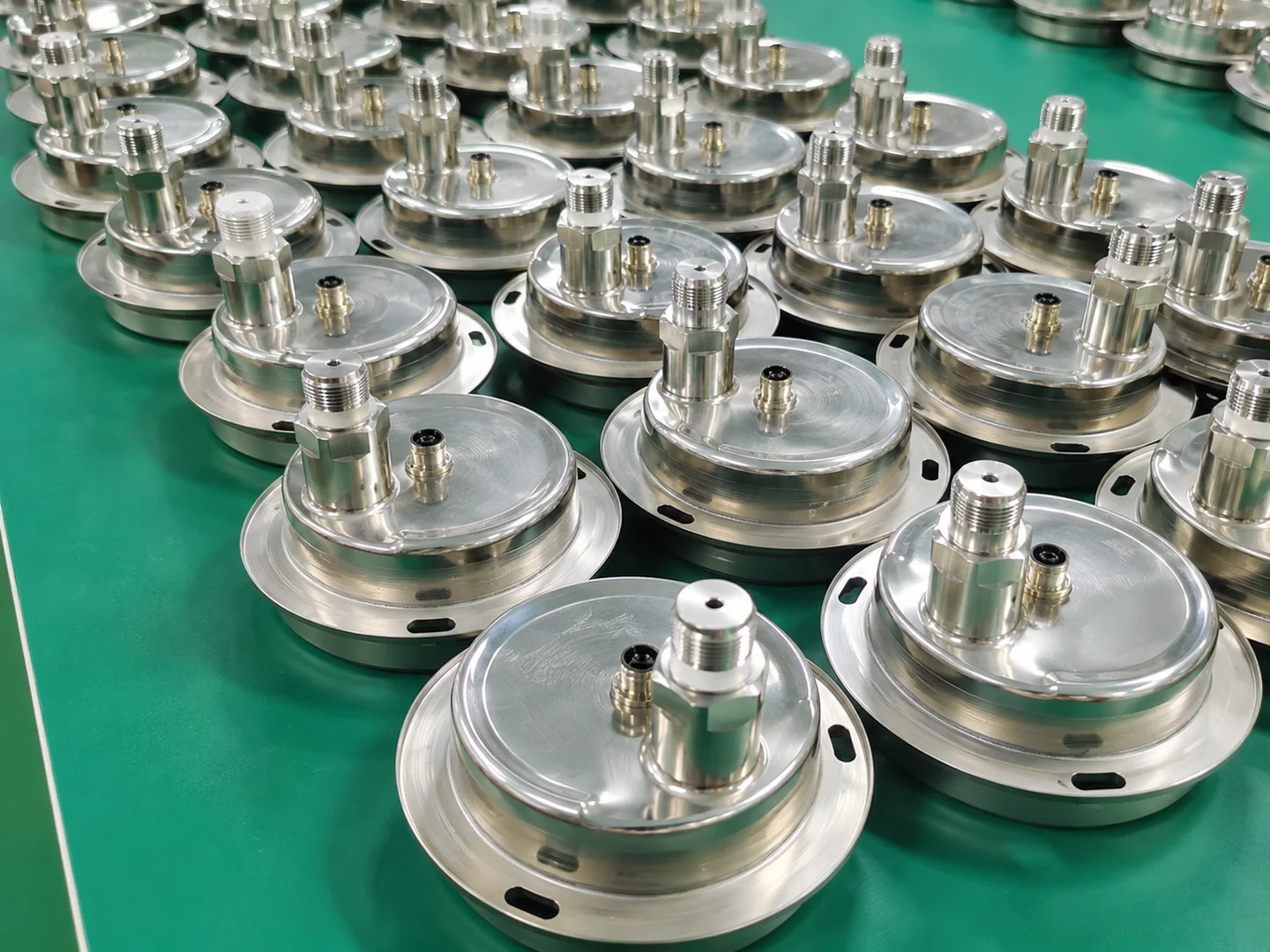 Circular metal instrument assemblies arranged on a green work surface